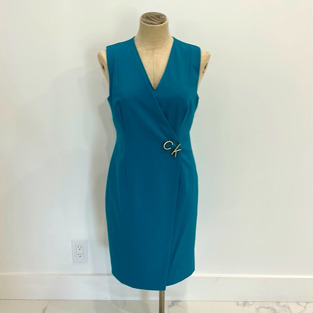 Calvin Klein turquoise crossover dress.